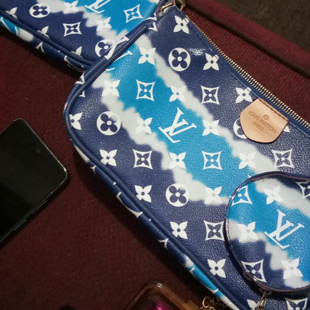 Three piece Louis Vuitton leather rochette designer bag